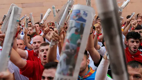 Runners participate in the traditional singing before the running of the bulls, during the San Fermin festival in Pamplona, Spain July 14, 2019.   *** Local Caption *** .