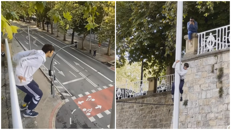 Un joven salta a una farola en la cuesta del Labrit en Pamplona. Navarra.com