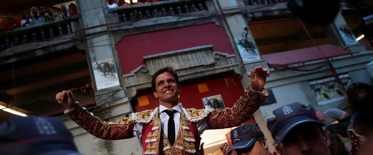 Spanish bullfighter Julian Lopez "El Juli" leaves the bullring on the shoulders of supporters after his good performance with the bulls at the end of a bullfight during the San Fermin Festival in Pamplona, northern Spain, July 12, 2016. REUTERS/Susana VeraCODE: X01622