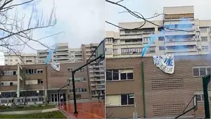 Alumnos de un instituto de Pamplona se encaraman en el tejado con bengalas y pancartas en favor de los 'okupas'
