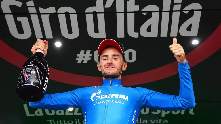 . Alpe Di Siusi (Italy), 22/05/2016.- Russian rider Alexander Foliforov of the Gazprom - RusVelo team celebrates on the podium after winning the 15th stage of the Giro d'Italia cycling race, a mountain time trial over 10.8km from Castelrotto to Alpe di Siusi, Italy, 22 May 2016. (Ciclismo, Italia) EFE/EPA/LUCA ZENNARO