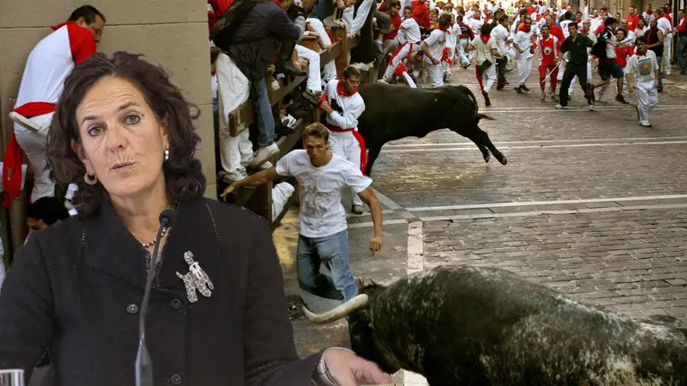 Runners try to avoid a bull at the Estafeta curve during the fifth running of the bulls at Pamplona's San Fermin festival July 11, 2005. Four people were gored running with the bulls in Pamplona on Monday and eight others were injured in the stampede of fighting bulls through the city's streets, a Red Cross spokesman said.  REUTERS/Albert Gea