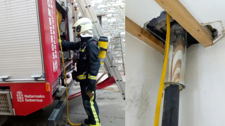 Una unidad de Bomberos de Navarra y la chimenea que se ha incendiado en una vivienda de Echarri