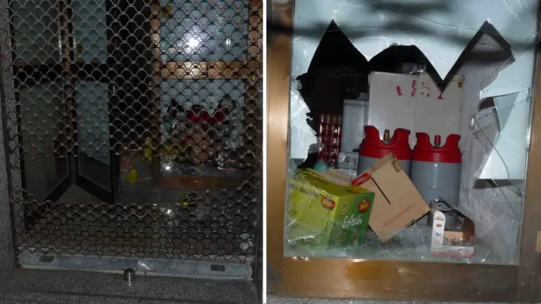Los destrozos que provocaron los dos ladrones para entrar en el local donde fueron descubiertos. POLICÍA MUNICIPAL