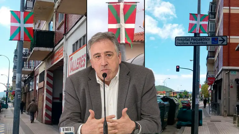 Imagen del alcalde de Pamplona, Joseba Asirón, junto a las ikurriñas colocadas en la Chantrea durante las fiestas patronales del barrio NAVARRACOM