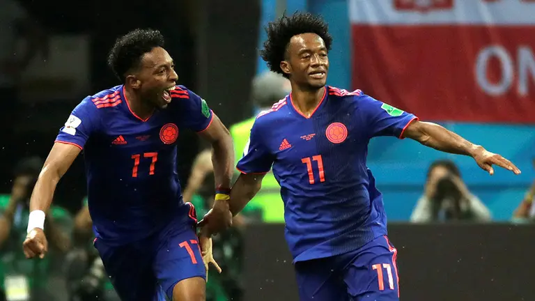 El delantero colombiano Cuadrado (d) tras marcar el 0-3 durante el partido Polonia-Colombia, del Grupo H del Mundial de Fútbol de Rusia 2018, en el Kazán Arena de Kazán, Rusia, 24 de junio de 2018. EFE.