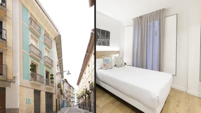 Ubicación y una de las habitaciones de Antique Pamplona Tres Reyes Apartments