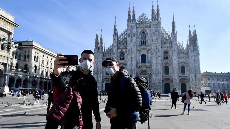 24 February 2020, Italy, Milan: Two tourists take a selfie while wearing surgical masks in front of the Duomo di Milano amid the outbreak of the coronavirus. Photo: Claudio Furlan/LaPresse via ZUMA Press/dpa
ONLY FOR USE IN SPAIN

24 February 2020, Italy, Milan: Two tourists take a selfie while wearing surgical masks in front of the Duomo di Milano amid the outbreak of the coronavirus. Photo: Claudio Furlan/LaPresse via ZUMA Press/dpa

2/24/2020 ONLY FOR USE IN SPAIN
