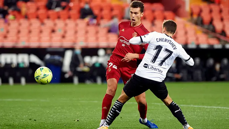 Denis Cheryshev of Valencia CF and Lucas Torro of Osasuna during the La Liga Santander mach between Valencia and Osasuna at Estadio de Mestalla on 23 January, 2021 in Valencia, Spain