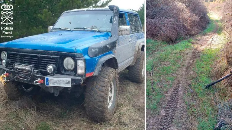 Un todoterreno y marcas de las ruedas en una pista forestal POLICÍA FORAL