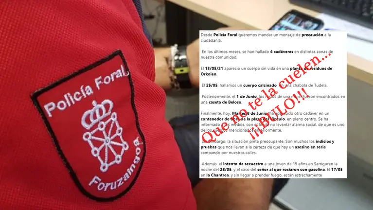 Un agente de la Policía Foral con un móvil y el bulo difundido a través de las redes sociales. ARCHIVO