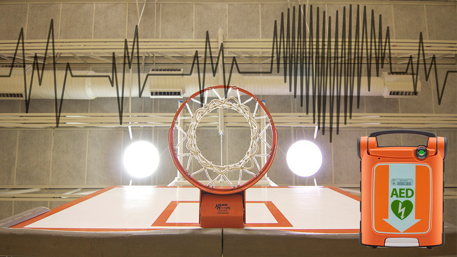 Fotomontaje de un desfibrilador con una canasta de baloncesto de un polideportivo