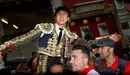 Peruvian bullfighter Andres Roca Rey leaves the bullring on the shoulders of supporters after his good performance with the bulls at the end of a bullfight during the San Fermin Festival in Pamplona, northern Spain, July 13, 2016. REUTERS/Susana Vera