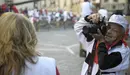 Bullfight photographer Francisco Cano, Canito, takes a picture of a television presenter at Telefonica Corner before the second running of the bulls of the San Fermin festival in Pamplona July 8, 2011.