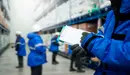 Un trabajador toma nota tras recibir la mercancia desplazada al almacén de una fábrica ARCHIVO 1