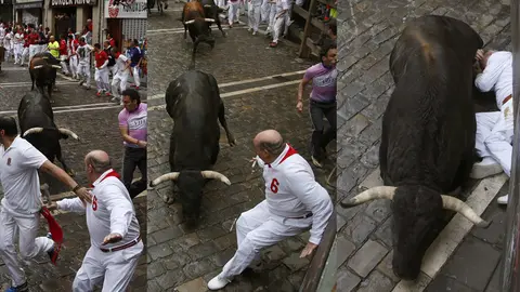 Secuencia de un mozo evita la embestida de un toro de la ganadería de Núñez del Cuvillo a su paso por la curva de Estafeta durante el séptimo encierro de los sanfermines 2016. EFEJavier Lizón (5)