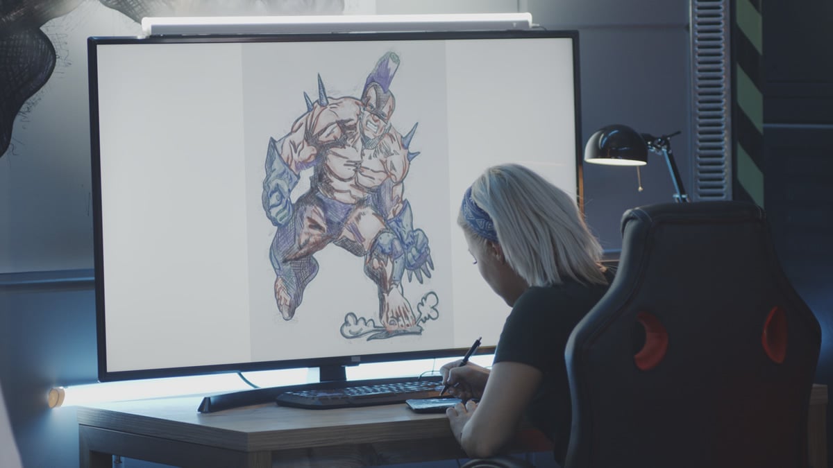 Una diseñadora creando la imagen de un videojuego delante de un ordenador. CEDIDA